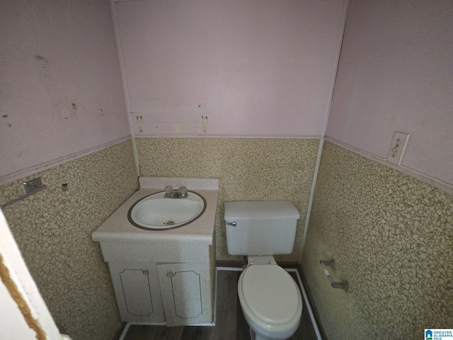 bathroom with vanity and toilet