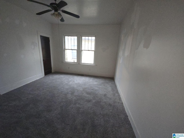 carpeted empty room featuring ceiling fan