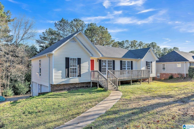 ranch-style home featuring a front lawn, a deck, and a garage