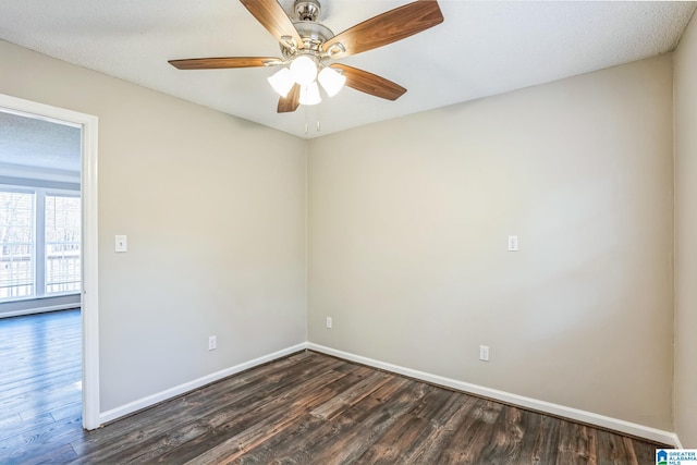 spare room with ceiling fan and dark wood-type flooring