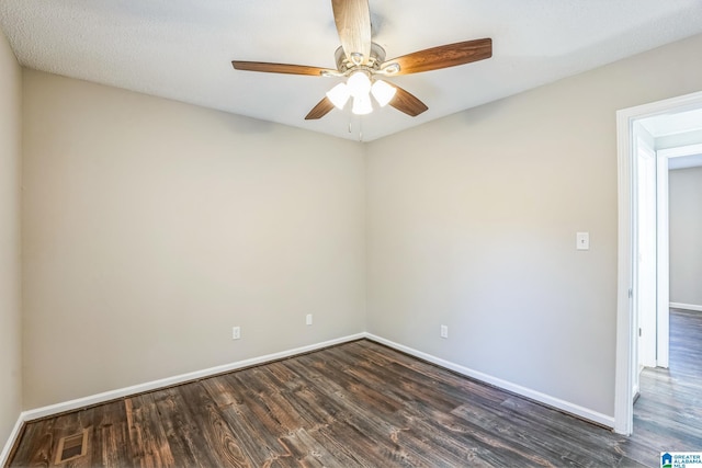 empty room with ceiling fan and dark wood-type flooring