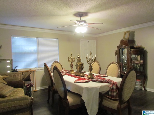 dining area with a textured ceiling, dark hardwood / wood-style flooring, ceiling fan, and ornamental molding