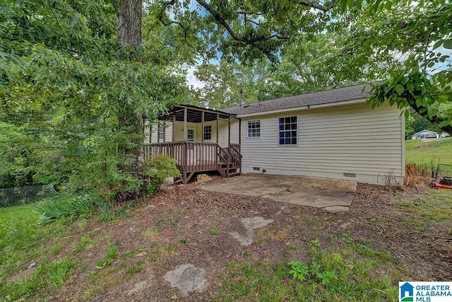 back of house with a patio