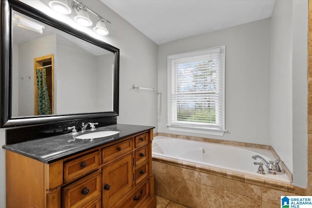 bathroom featuring vanity, tiled bath, and tile patterned floors