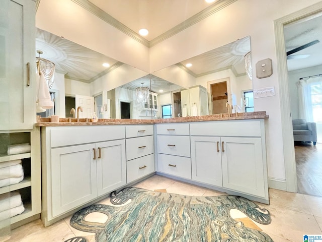 bathroom featuring tile patterned floors, vanity, and ornamental molding