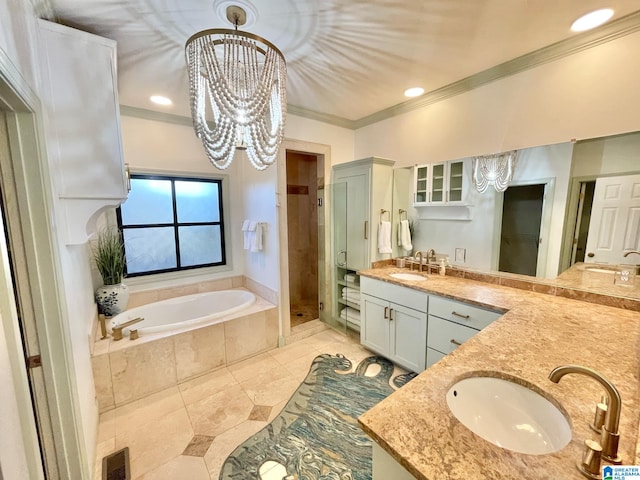 bathroom featuring vanity, plus walk in shower, tile patterned flooring, ornamental molding, and a notable chandelier