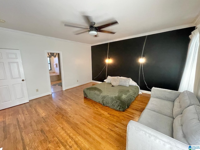 bedroom with ensuite bath, ceiling fan, and ornamental molding