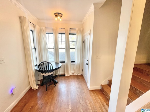 interior space featuring light hardwood / wood-style flooring and crown molding