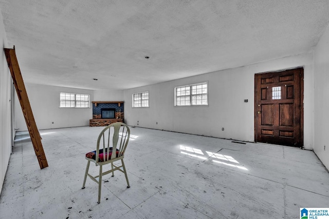 unfurnished living room featuring a fireplace