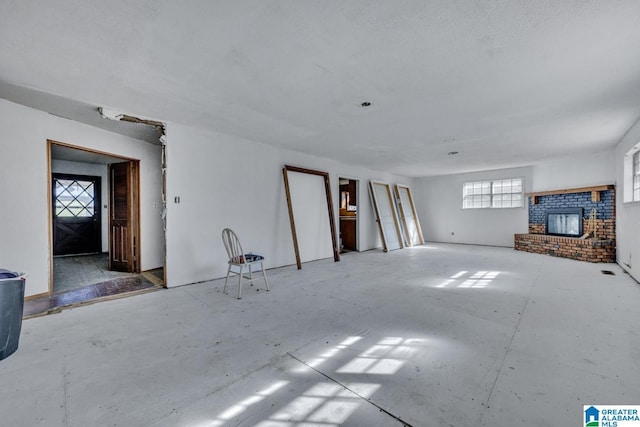 unfurnished living room with a fireplace