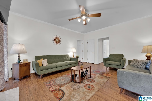 living room featuring hardwood / wood-style floors, ceiling fan, and ornamental molding