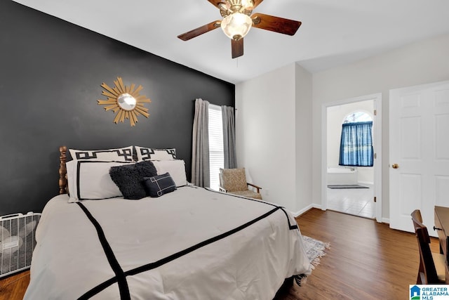 bedroom featuring ceiling fan and dark wood-type flooring