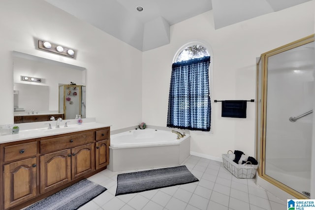 bathroom featuring tile patterned flooring, vanity, and separate shower and tub