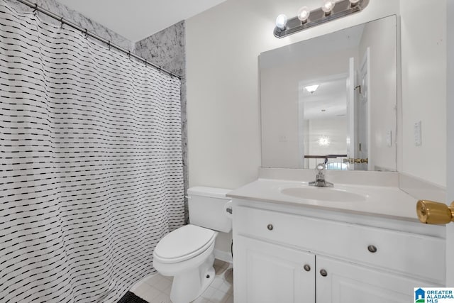 bathroom featuring vanity, toilet, and curtained shower