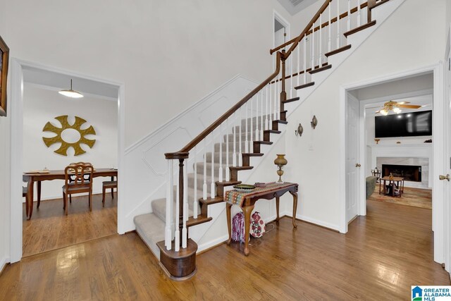 stairway featuring wood-type flooring