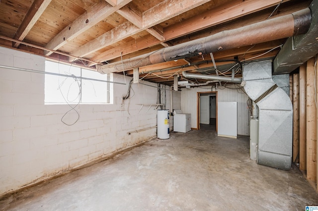 basement featuring heating unit and water heater