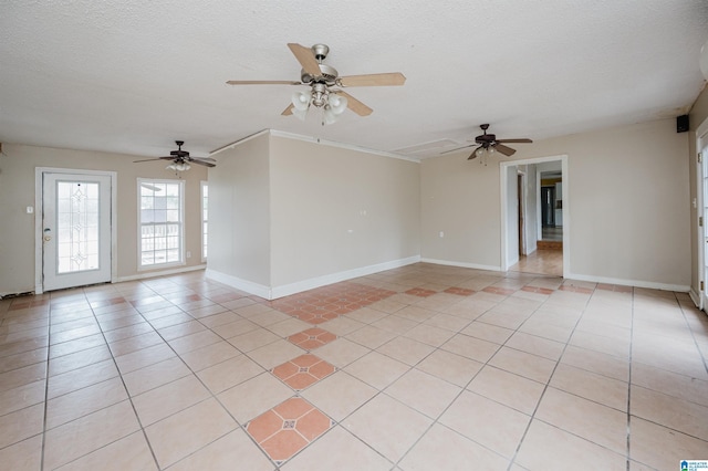 unfurnished room featuring light tile patterned floors and a textured ceiling