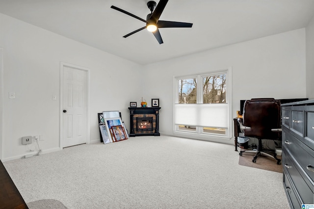 interior space featuring ceiling fan and carpet floors