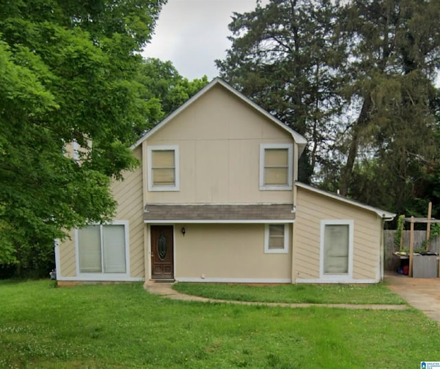 rear view of house with a lawn