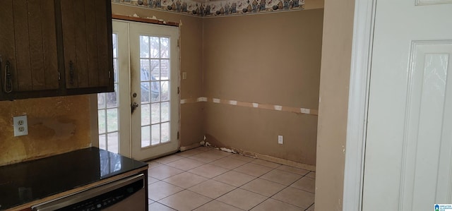 doorway to outside with french doors and light tile patterned floors