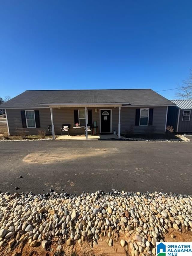 single story home with a storage unit