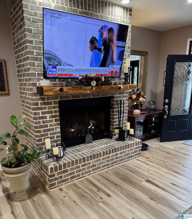 living room featuring a fireplace and hardwood / wood-style flooring