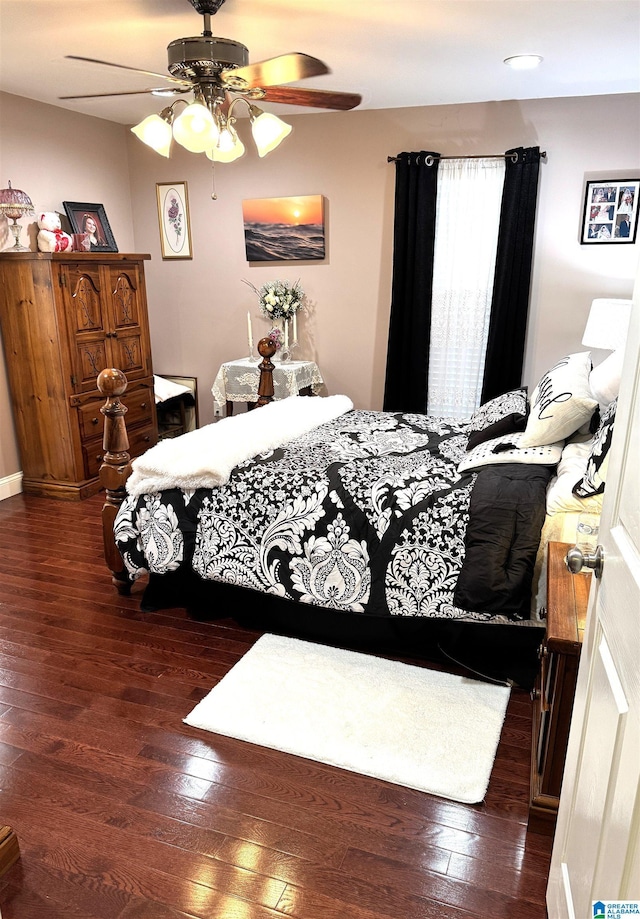 bedroom featuring ceiling fan and dark hardwood / wood-style flooring