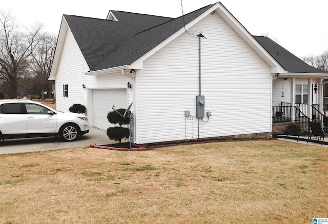 view of home's exterior featuring a garage and a yard