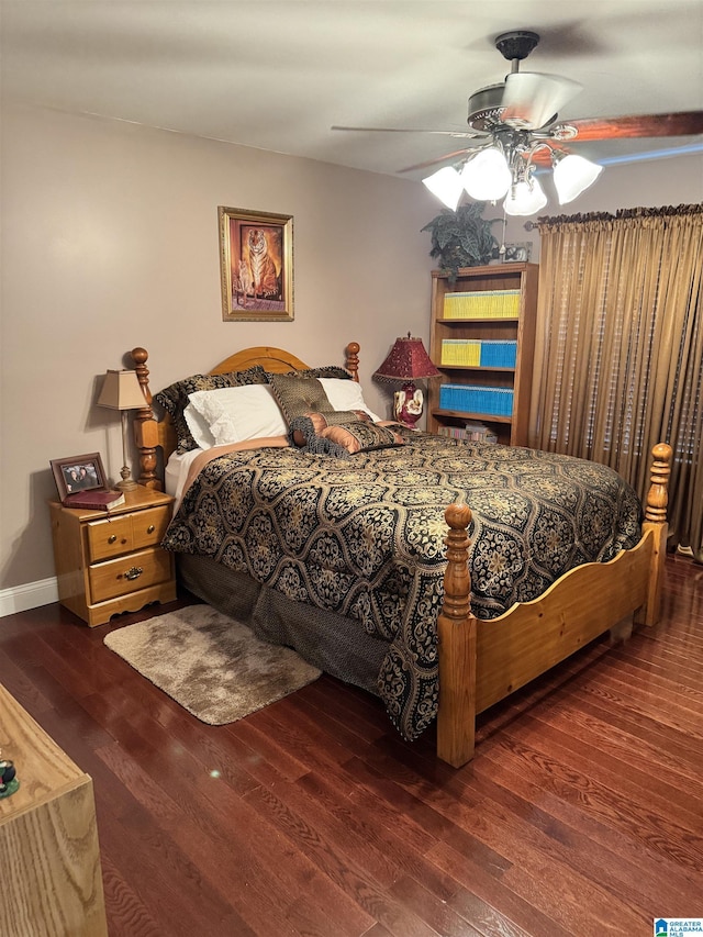 bedroom with ceiling fan and dark hardwood / wood-style floors