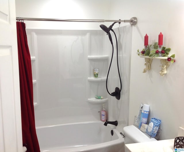 bathroom with toilet and shower / tub combo