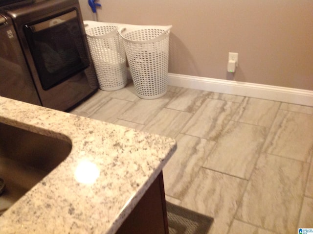 interior space featuring washer / clothes dryer and sink