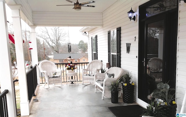 exterior space featuring covered porch and ceiling fan