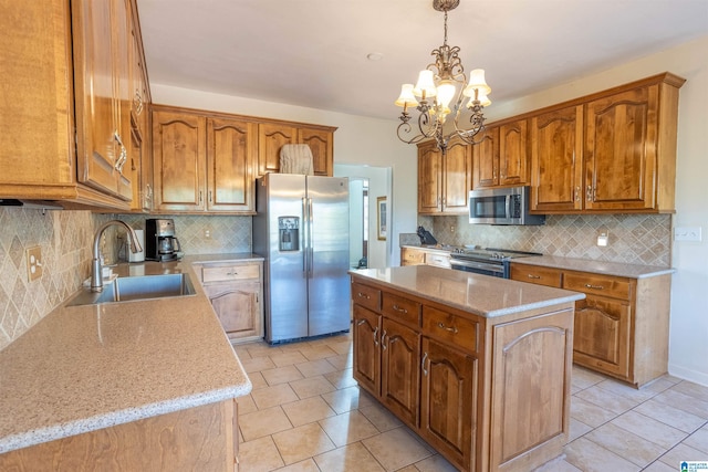 kitchen featuring sink, a center island, decorative light fixtures, light tile patterned floors, and appliances with stainless steel finishes