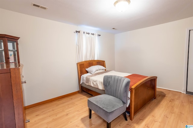 bedroom with light wood-type flooring