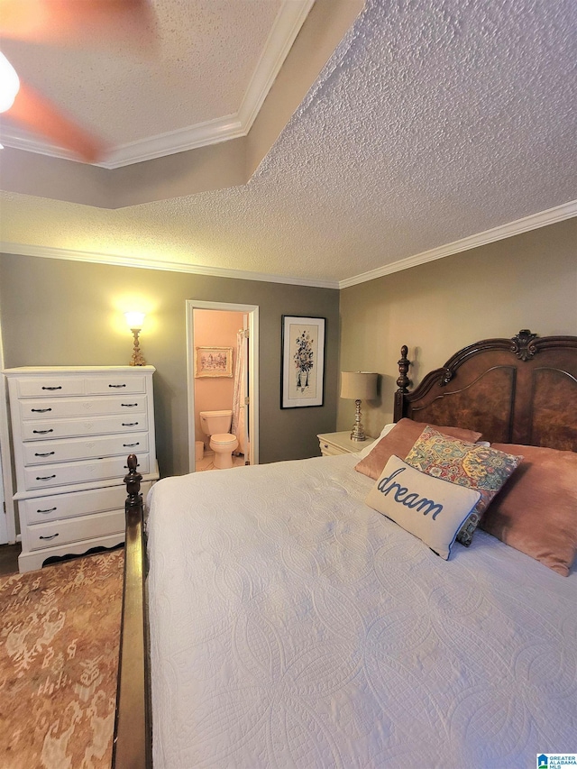 bedroom featuring connected bathroom, crown molding, and a textured ceiling