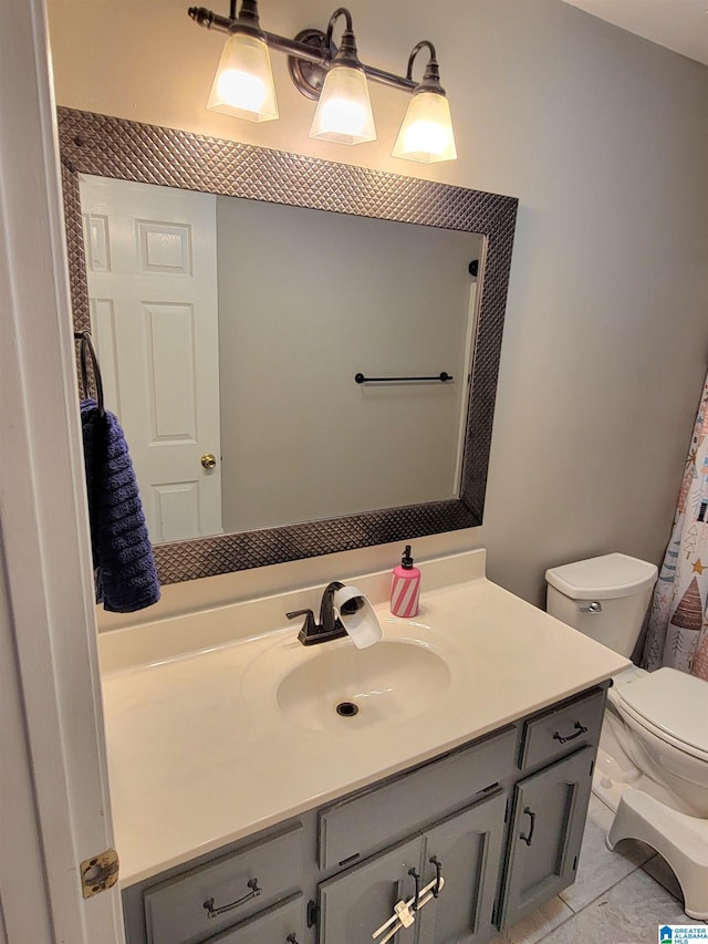 bathroom featuring vanity and toilet