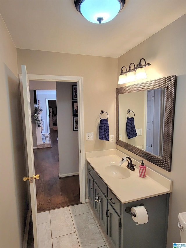 bathroom with tile patterned floors and vanity