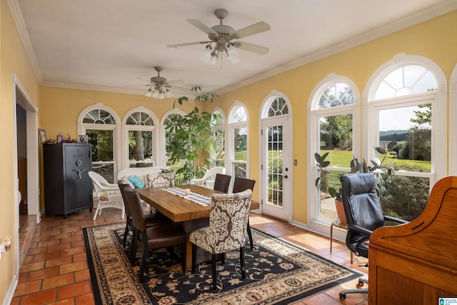 sunroom / solarium with ceiling fan and a healthy amount of sunlight