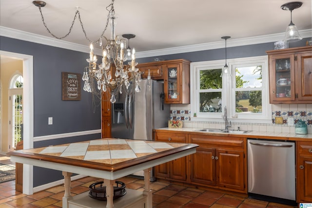 kitchen featuring tile countertops, backsplash, and stainless steel appliances