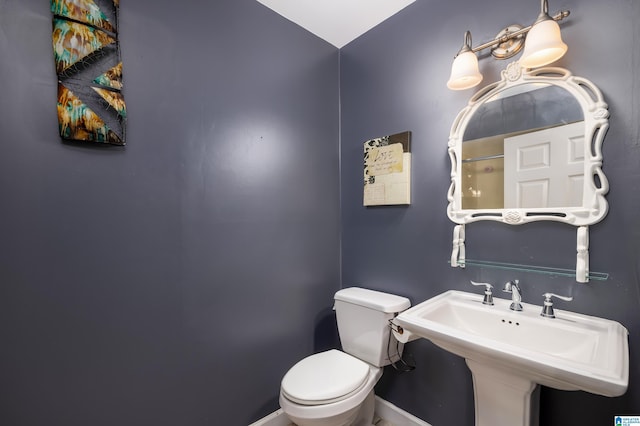 bathroom with sink and toilet