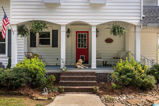 property entrance with covered porch