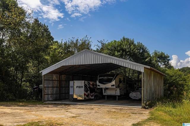 view of parking / parking lot featuring a carport