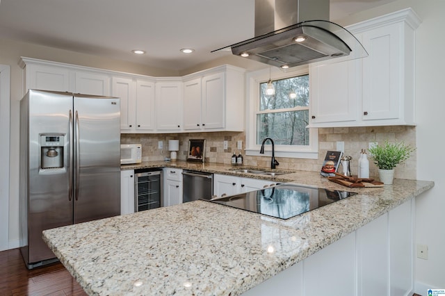 kitchen featuring white cabinets, island exhaust hood, stainless steel appliances, and wine cooler