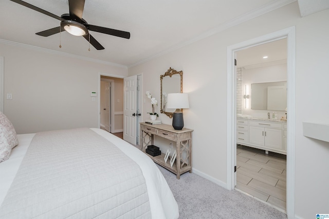 carpeted bedroom featuring ceiling fan, ornamental molding, and connected bathroom