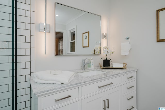 bathroom featuring vanity and ornamental molding