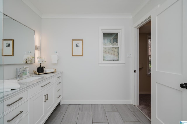 bathroom with vanity and ornamental molding