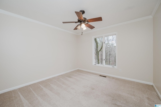 unfurnished room with carpet flooring, ceiling fan, and crown molding