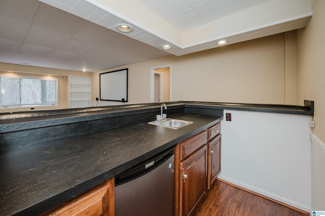 interior space featuring dark wood-type flooring, sink, and stainless steel dishwasher