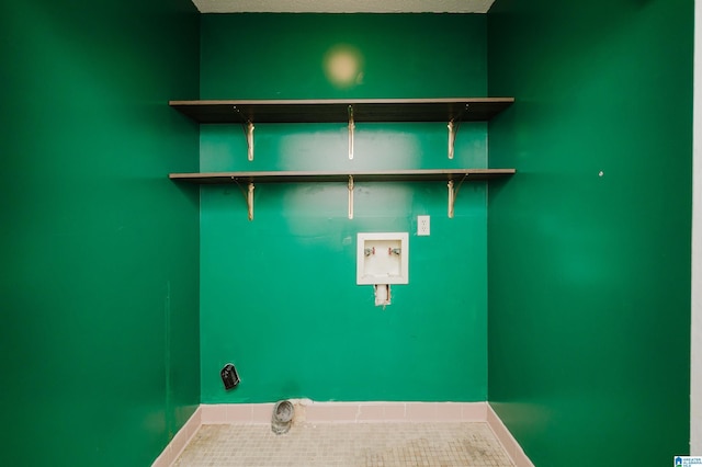 clothes washing area with washer hookup and a textured ceiling