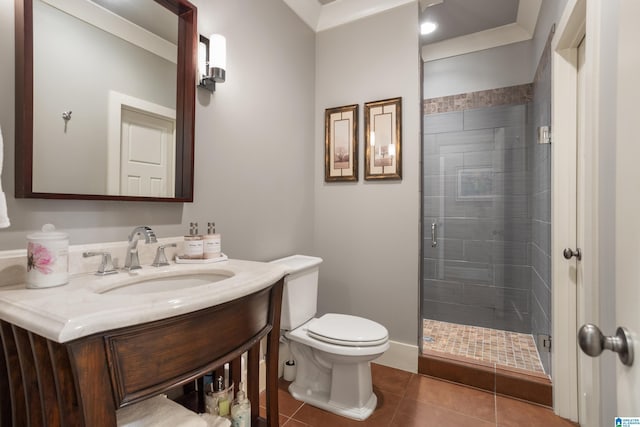 bathroom with vanity, tile patterned floors, crown molding, toilet, and an enclosed shower